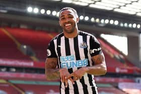 Callum Wilson of Newcastle United celebrates after scoring a goal which was later disallowed due to a handball during the Premier League match between Liverpool and Newcastle United at Anfield on April 24, 2021 in Liverpool, England.