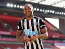 Callum Wilson of Newcastle United celebrates after scoring a goal which was later disallowed due to a handball during the Premier League match between Liverpool and Newcastle United at Anfield on April 24, 2021 in Liverpool, England.