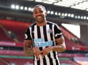 Callum Wilson of Newcastle United celebrates after scoring a goal which was later disallowed due to a handball during the Premier League match between Liverpool and Newcastle United at Anfield on April 24, 2021 in Liverpool, England.