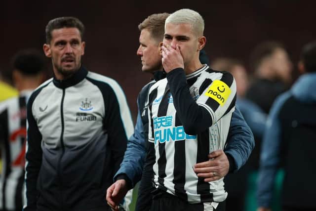 Newcastle United's Bruno Guimaraes is consoled at the end of the Carabao Cup final.