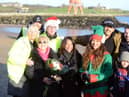 Jade Thirlwall, front row second from right, and Josef Craig, far right back row, with friends, family and members of the Cancer Connections charity
