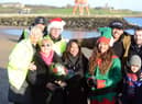 Jade Thirlwall, front row second from right, and Josef Craig, far right back row, with friends, family and members of the Cancer Connections charity