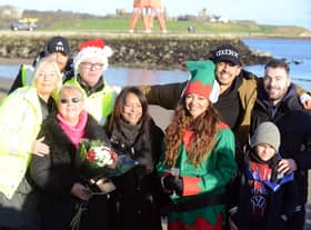 Jade Thirlwall, front row second from right, and Josef Craig, far right back row, with friends, family and members of the Cancer Connections charity