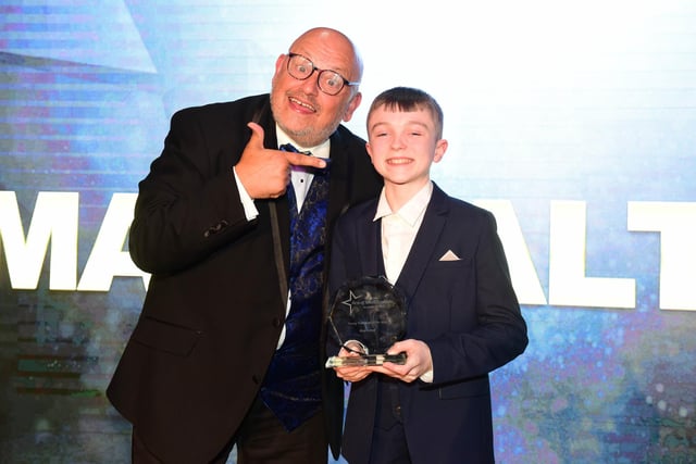 Young Performer of the Year Award winner Max Walton, receives his prize from Ray Spencer.