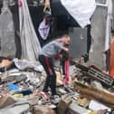 A Palestinian man inspects the damages amid the rubble following Israeli bombardment in Rafah in the southern Gaza Strip as battles continue. Photo by Mohammed Abed/AFP via Getty Images