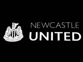The Newcastle United club crest on the side of St James' Park.