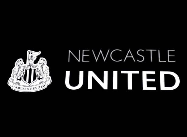 The Newcastle United club crest on the side of St James' Park.