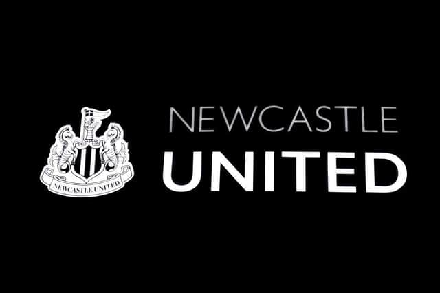 The Newcastle United club crest on the side of St James' Park.