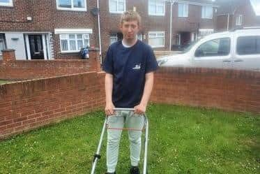 Devlin with his new lawn mower, donated by Brian.