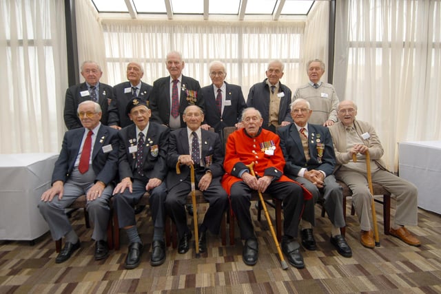 Former prisoners of war who met at the hotel 14 years ago. Have you spotted someone you know?