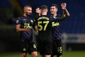 Elliot Anderson celebrates his second goal with team-mates.
