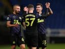 Elliot Anderson celebrates his second goal with team-mates.