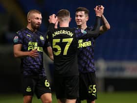 Elliot Anderson celebrates his second goal with team-mates.