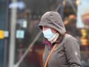 A file picture of a passerby in a mask as concerns are raised over the level of covid infection in the North East.