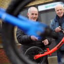 South Tyneside Council Councillor, Ernest Gibson (left), with Sports Recycler's Workshop Manager, Keith Thompson, and one of the donated balance bikes.