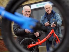 South Tyneside Council Councillor, Ernest Gibson (left), with Sports Recycler's Workshop Manager, Keith Thompson, and one of the donated balance bikes.