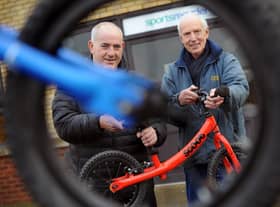 South Tyneside Council Councillor, Ernest Gibson (left), with Sports Recycler's Workshop Manager, Keith Thompson, and one of the donated balance bikes.