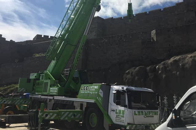 A crane was spotted lifting equipment into the castle.