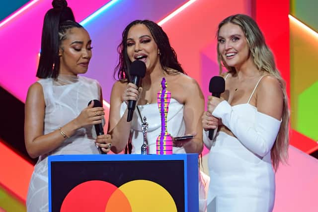 Little Mix members Leigh-Anne Pinnock (left), Jade Thirlwall (middle) and Perrie Edwards (right) at the Brit Awards. Photo: PA.