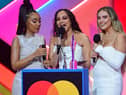 Little Mix members Leigh-Anne Pinnock (left), Jade Thirlwall (middle) and Perrie Edwards (right) at the Brit Awards. Photo: PA.