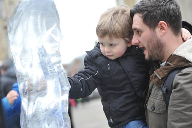 Martin Culmer with son Eli taking a close look at the sculptures at Durham's Fire and Ice Festival in a previous year