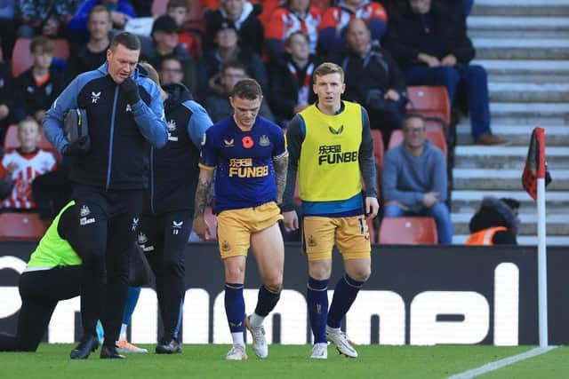 Kieran Trippier of Newcastle United receives medical treatment during the Premier League match between Southampton FC and Newcastle United at Friends Provident St. Mary's Stadium on November 06, 2022 in Southampton, England. (Photo by David Cannon/Getty Images)