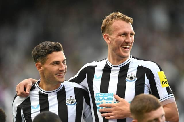 Newcastle defenders Fabian Schar (l) and Dan Burn share a joke during the Pre Season friendly match between Newcastle United and Atalanta at St James' Park on July 29, 2022 in Newcastle upon Tyne, England. (Photo by Stu Forster/Getty Images)