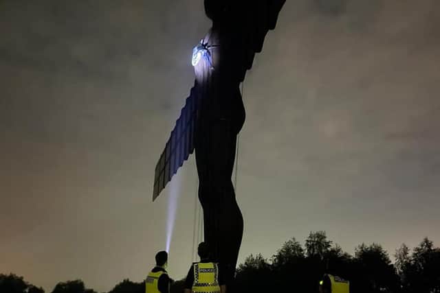 Handout photo of Ben Fada attempting to put an England badge on the Angel of the North ahead of the England football team playing in the UEFA Euro 2020 Final on Sunday. Issue date: Saturday July 10, 2021.