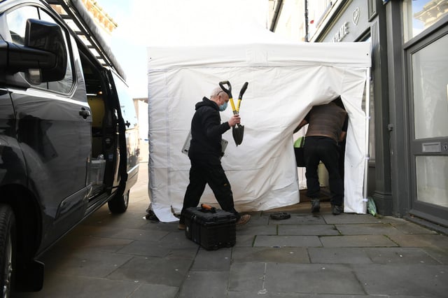 Contractors arriving at The Clean Plate cafe in Southgate Street, Gloucester where excavation work is to begin after police found "possible evidence" of where a suspected teenage victim of serial killer Fred West may be buried. Forensic archaeologists have been undertaking exploratory work in connection with the disappearance of 15-year-old Mary Bastholm who was last seen alive in January 1968. Picture date: Wednesday May 19, 2021.