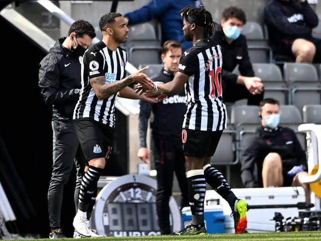 Callum Wilson of Newcastle United is substituted on for Allan Saint-Maximin  during the Premier League match between Newcastle United and West Ham United at St. James Park on April 17, 2021 in Newcastle upon Tyne, England.