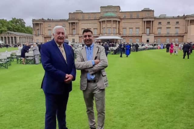 Local historian Paul Perry, left and Nico were invited to Buckingham Palace.