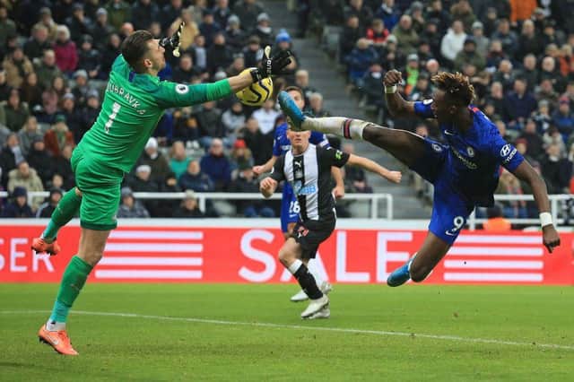 Newcastle United's Slovakian goalkeeper Martin Dubravka (L) saves a shot from Chelsea's English striker Tammy Abraham during the English Premier League football match between Newcastle United and Chelsea at St James' Park in Newcastle-upon-Tyne, north east England on January 18, 2020.