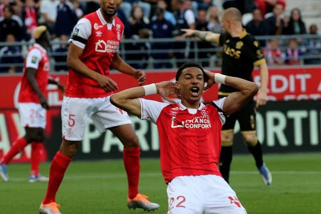 Reims' forward Hugo Ekitike celebrates after scoring a goal during the French L1 football match between Stade de Reims and OGC Nice at Stade Auguste-Delaune in Reims, northern France on May 21, 2022. (Photo by FRANCOIS NASCIMBENI/AFP via Getty Images)