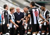 Steve Bruce, third left, and his players.