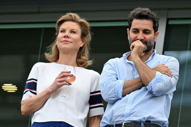 Newcastle United's English minority owner Amanda Staveley (L) and her husband Mehrdad Ghodoussi (R) await kick-off in the English Premier League football match between Chelsea and Tottenham Hotspur at Stamford Bridge in London on August 14, 2022. (Photo by GLYN KIRK/AFP via Getty Images)