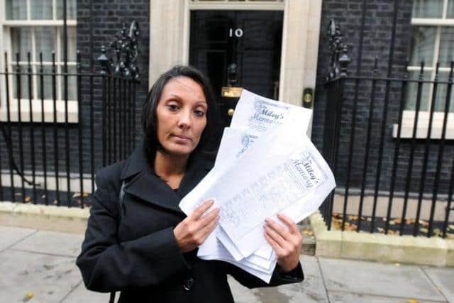 Sharon Eckert hands over her petition to Downing Street.