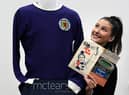 Auctioneer Amy Cameron with Jim Baxter's match worn jersey from Scotland's 3-2 win over then world champions, England, at Wembley in 1967.