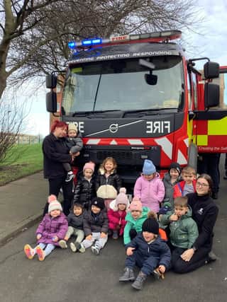 Youngsters at Nurserytime with the fire engine.