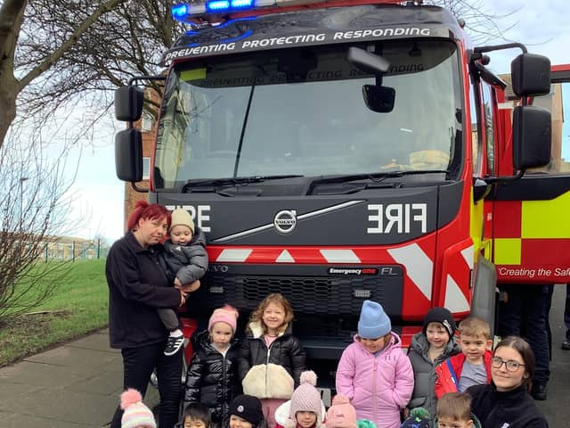 Youngsters at Nurserytime with the fire engine.