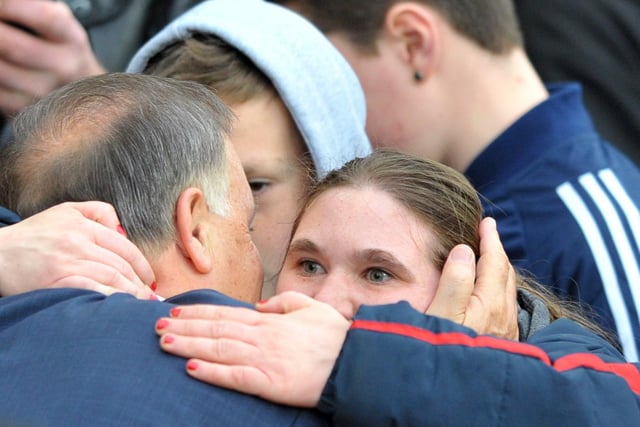 Sunderland manager Dick Advocaat has a hug from a supporter before their 2-2 draw at the Stadium of Light against West Ham United in 2015.