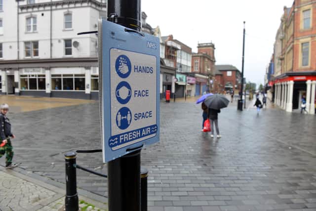 Covid-19 warning signage in South Shields town centre during coronavirus measures in 2021.