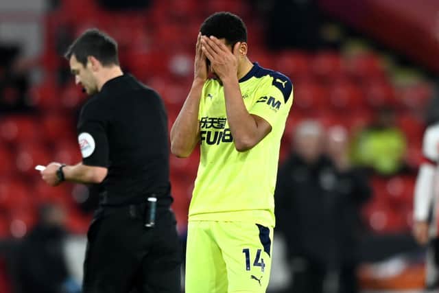 Newcastle United's Isaac Hayden reacts after receiving a yellow card.