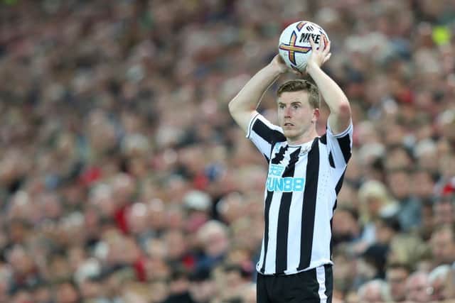 LIVERPOOL, ENGLAND - AUGUST 31: Matt Targett of Newcastle United takes a throw in during the Premier League match between Liverpool FC and Newcastle United at Anfield on August 31, 2022 in Liverpool, England. (Photo by Alex Livesey/Getty Images)