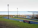 The elevated walkway helps people walk through the park if they want to avoid steps.