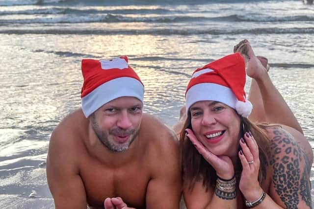 Peter Major and Linda Snobkova, from Slovakia, donned Christmas hats to take the plunge.

Photograph: North News and Pictures NNP