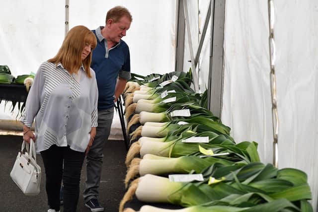 Visitors admire the leeks entered into a previous Monkton Leek, Vegetable and Floral Society show.