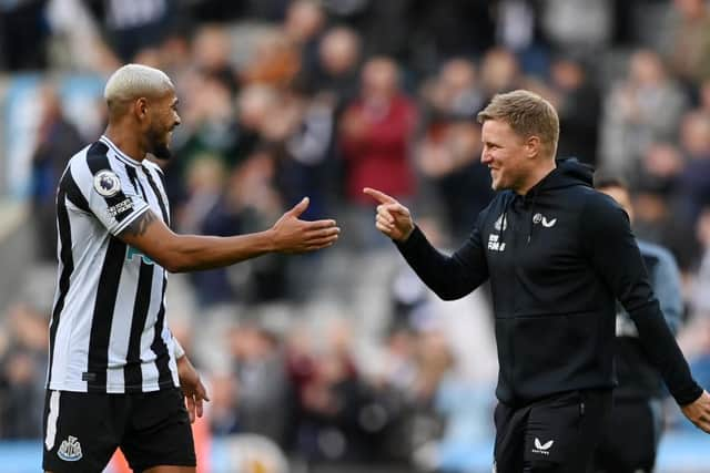 Joelinton of Newcastle United celebrates victory with Eddie Howe, Manager of Newcastle United following the Premier League match between Newcastle United and Brentford FC at St. James Park on October 08, 2022 in Newcastle upon Tyne, England. (Photo by Stu Forster/Getty Images)