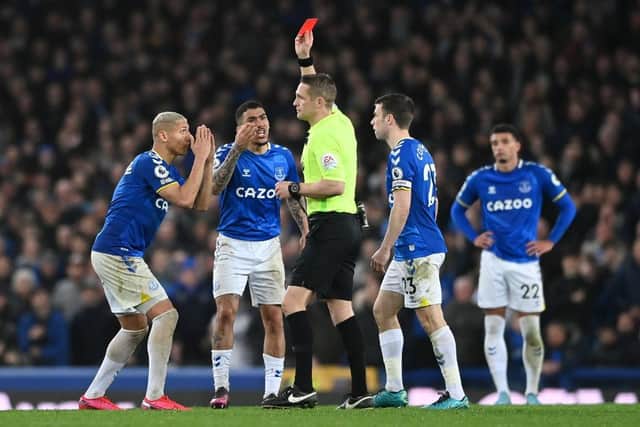 Richarlison of Everton reacts as Allan of Everton is shown a red card from referee Craig Pawson during the Premier League match between Everton and Newcastle United at Goodison Park on March 17, 2022 in Liverpool, England. (Photo by Stu Forster/Getty Images)