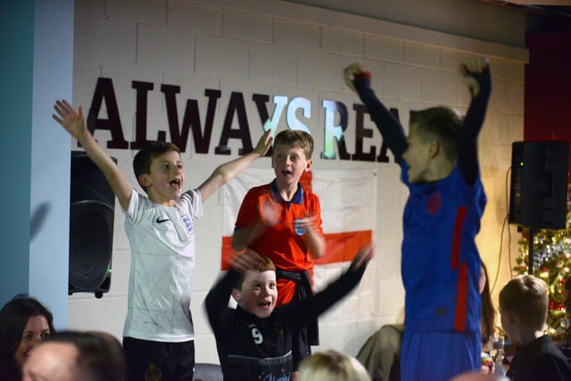 Young fans celebrate an England goal.
