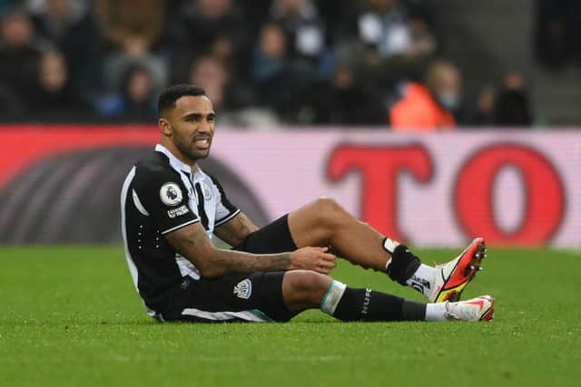 Callum Wilson of Newcastle United reacts with an injury during the Premier League match between Newcastle United and Manchester United at St James' Park on December 27, 2021 in Newcastle upon Tyne, England. (Photo by Stu Forster/Getty Images)